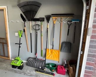 Snow thrower, shovels, brooms, rakes, gas can.