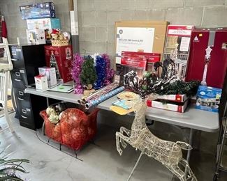 HON file cabinet, lots of Christmas, Ceramic Christmas tree in box, lights, Sleigh, Reindeer, wrapping paper. Telescope, New bullet mixer.