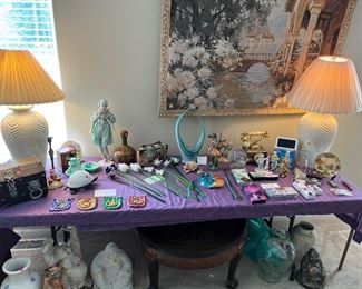 Blown glass basket, turtle lamp, chest, slot machine lighter, rock group YES belt buckle, clowns, many more items.