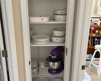 French white Corell oven ware with lids. Purple Kitchen Aid mixer.
