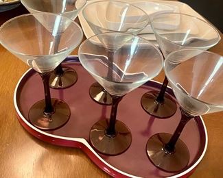 Close up of 6 Martini glasses with purple stems