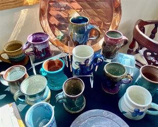 Pottery mugs, copper platter