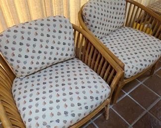 Pair of rattan chairs with cushions