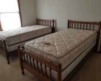 Twin beds with mattresses