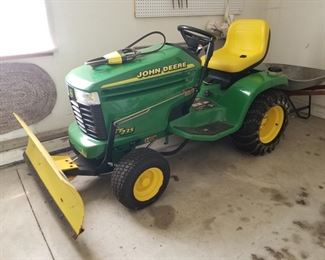 John Deere GT235, starts and runs great!  Has snow plow and 48" mowing deck