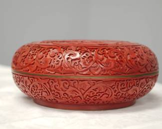 Side view of the large Chinese carved cinnabar round covered box