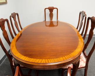 Detail on the Drexel dining table with two leaves and six dining chairs