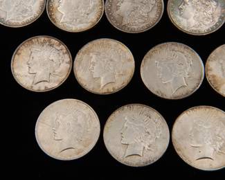 Detail on the Twenty Five old silver dollars, eighteen (18) Morgan Silver Dollars and seven (7) Peace Silver Dollars