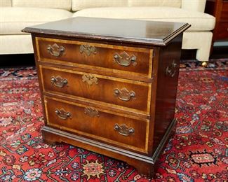 Small 20th century chest or stand in a Chippendale Style measuring 23" across, 15 1/2" deep, and  22" tall with a lovely patina and typical signs of wear from age and use.