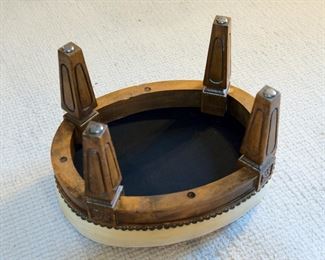 Petite oval needlepoint stool measuring 16" long, 12" deep, and 11" tall, in excellent vintage condition.