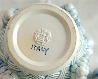 Italian pottery covered centerpiece, a fruit basket.  Minor damages to extremities -- tips of three leaves on lid flaked off, two tips of leaves on base flaked off.   Measures 8 1/2" tall and 8 1/2" across