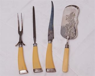Carving set with celluloid handles and a crumber without a brush.