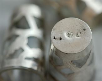 Markings on the set of eight shot glasses in Mexican sterling silver holders.