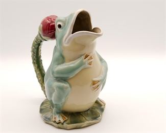 Contemporary majolica style figural frog ewer on lily pad with lotus blossom handle, 9 1/2" tall.