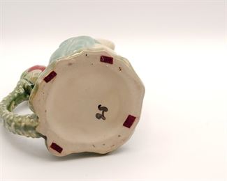 Contemporary majolica style figural frog ewer on lily pad with lotus blossom handle, 9 1/2" tall.