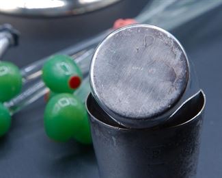 Detail on the silverplated shotglasses