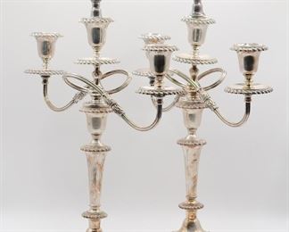 Stately pair of silverplate candelabrum by the Friedman Silver Company retaining their decorative finials