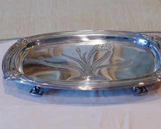 Another view of the footed 1847 Rogers Brothers Daffodil pattern platter with well for juices