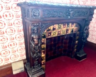 Amazingly detailed & carved antique tile and walnut baroque-style fireplace surround attributed to R.J. Horner