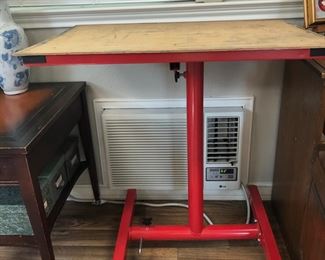 Tool stand with added wooden top. 