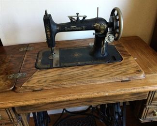 Antique sewing machine in chest. Greyhound “R”