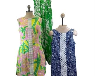 2 Lilly Pulitzer dresses, both size 10 with gold pineapple detail on zipper, and 1 Lilly Pulitzer jumpsuit size medium from the 20th anniversary collection.
