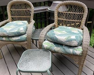 To outdoor wicker chairs with table