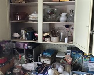 Sewing items and glass in basement kitchen area