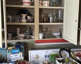 More in basement kitchen including lots of light bulbs and utensils