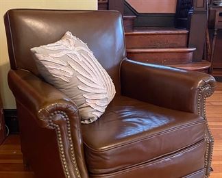Vintage brown faux leather chair with nailhead trim.