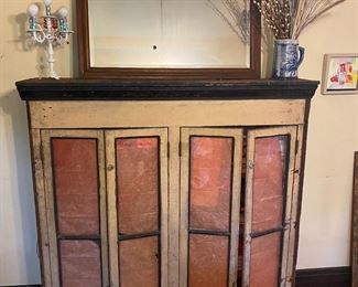 Antique kitchen cabinet tops with glass panels (lined with pink paper in photo).