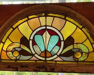 Antique stained glass window, has sustained some damage. Front room.
