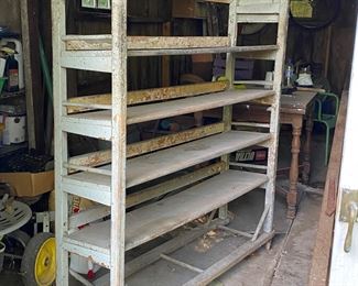 Antique dove gray 4-shelf factory drying rack on original wheels.