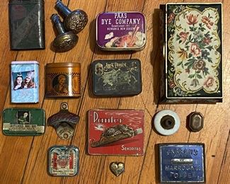 Variety of vintage & antique metal tins, doorknobs, Coca-Cola bottle opener, charms, medals, religious medallions, skeleton keys, tokens, printers blocks, protest pins, pocket knives, tin toys, marbles & much more.