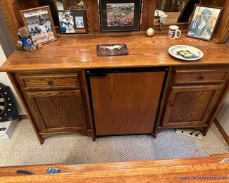 Free Standing Lighted Oak Bar with Brass Supports and Brass Footrest