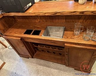 Free Standing Lighted Oak Bar with Brass Supports and Brass Footrest