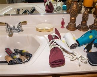 Curling irons, hair dryers