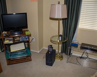 Coby TV, TV stand, decorative lamp, Sony Blu-ray player