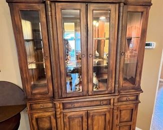 Beautiful 2 piece china cabinet. If you don't like as a china cabinet the top comes off and can be used as a buffet