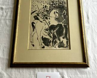 $750 - $1,000. Pablo Picasso.  "Toro y torrero".  Gallery label at back.  Unsigned but numbered (ll).  Measures approximately 9.75" by 13.25".