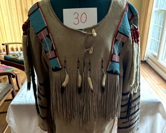$1,500 - $1,750. Beaded/Ermined powwow shirt (third quarter of 20th century).