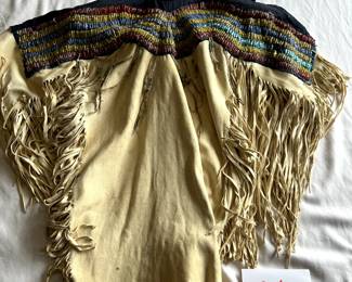 $2,250 - $2,750.  Beaded war shirt.