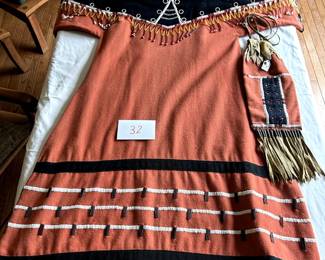 $2,500 - $3,000.	Beaded dress with bag