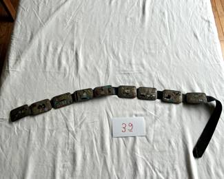 $1,000 - $1,250.	Pictorial Native American silver belt, inlaid with semiprecious stones.