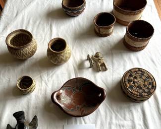 $250 - $300.	Mixed lot of birch baskets, South American basketry, and ceramics.