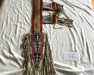 $350 - $500.  Native American parfleche, beaded, and fringed spear holder (20th century).  Measures approximately 41" long.