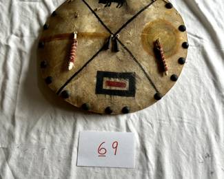 $1,000 - $1,500.  Native American rawhide and beaded shield.  Measures approximately 19" in diameter.
