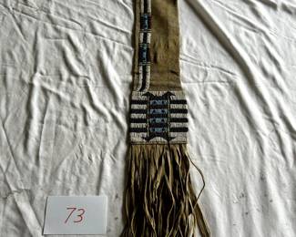 $3,500 - $5,000.	Northern Plains Cheyenne beaded pipe bag (traditional).  Per label, brain tan and sinew sewn.  Measures 5.5" by 30".