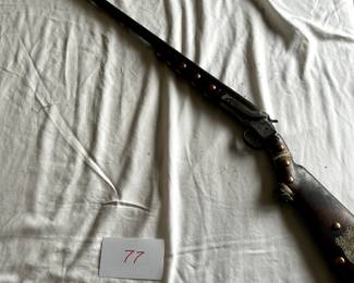 $750 - $1,000.	Studded Native American rifle 1 (nonoperational).