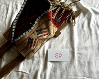 $3,000 - $5,000.	Native American porcupine quill cradleboard with American flags.  Measures 32" by 13".